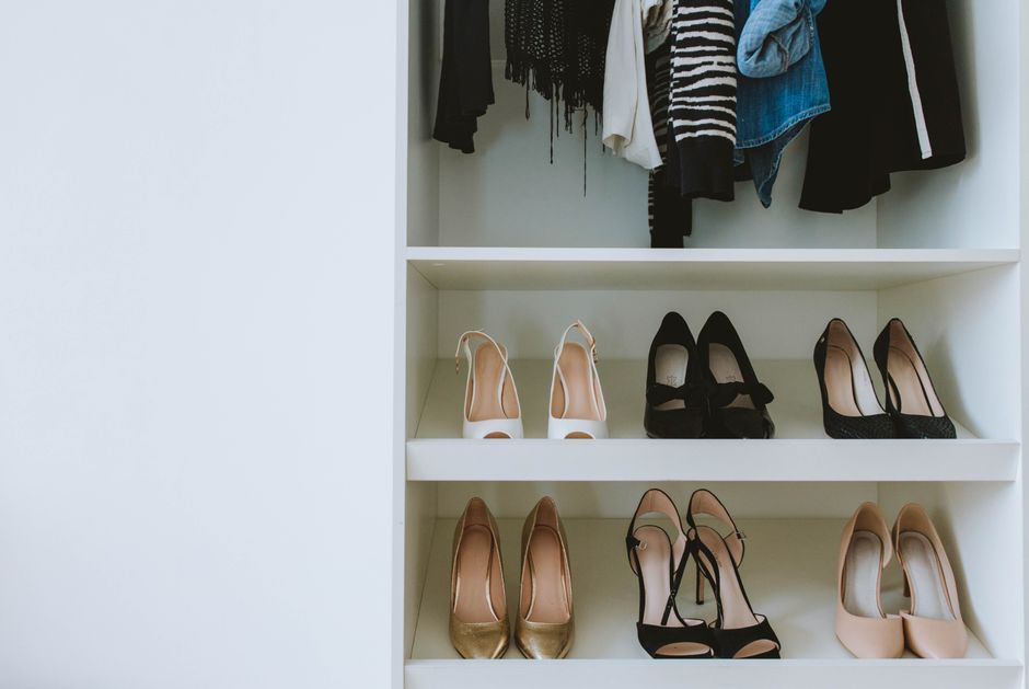 Organized shoe shelves in a spacious walk-in closet