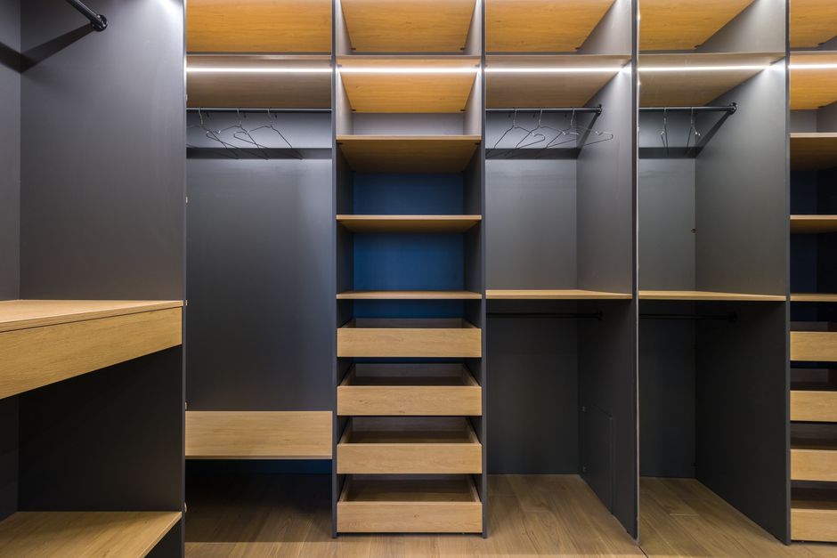 Modern wardrobe interior with adjustable shelves and drawers