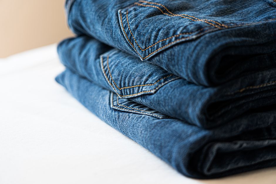 Folded clothes neatly organized in a custom built-in drawer