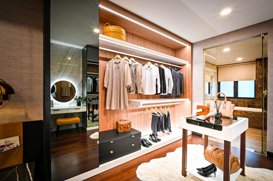 Luxury walk-in closet with custom shelving and lighting